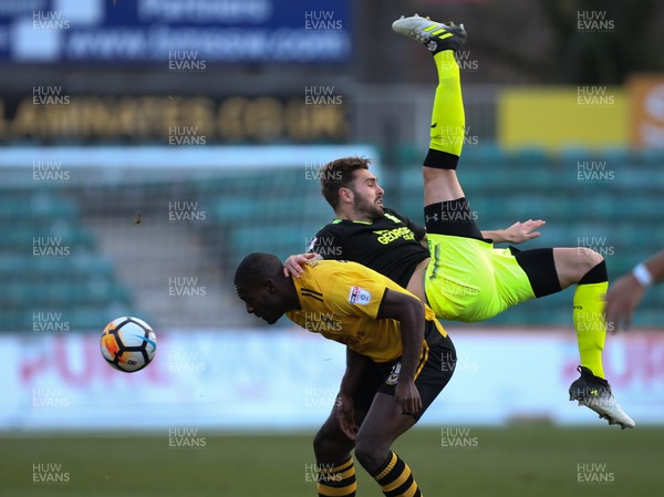 031217 - Newport County v Cambridge United, FA Cup Second Round - Greg Taylor of Cambridge United is upended by Frank Nouble of Newport County as they compete for the ball