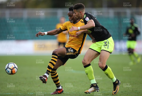 031217 - Newport County v Cambridge United, FA Cup Second Round - Shawn McCoulsky of Newport County and Jake Carroll of Cambridge United compete for the ball