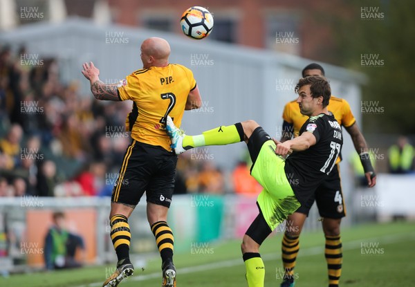 031217 - Newport County v Cambridge United, FA Cup Second Round - David Pipe of Newport County and Harrison Dunk of Cambridge United compete for the ball