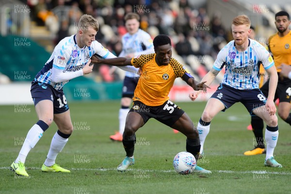 080220 - Newport County v Cambridge United - Sky Bet League 2 -  Jordan Green of Newport County takes on Harry Darling and Liam O'Neil of Cambridge United 