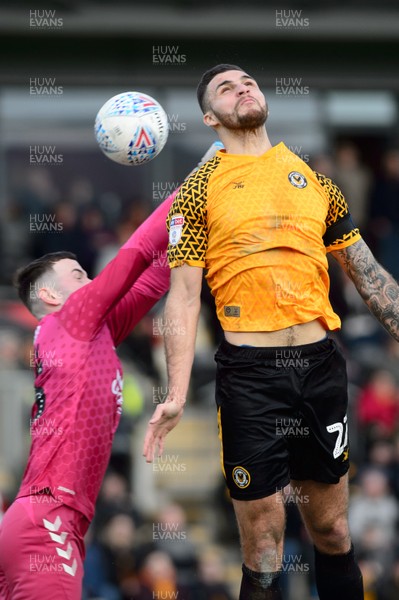 080220 - Newport County v Cambridge United - Sky Bet League 2 -  Ryan Inniss of Newport County and Callum Burton of Cambridge United compete for the ball 