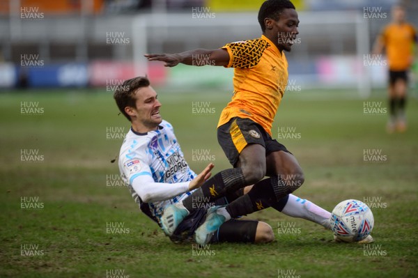 080220 - Newport County v Cambridge United - Sky Bet League 2 -  Jordan Green of Newport County is tackled by Harrison Dunk of Cambridge United 