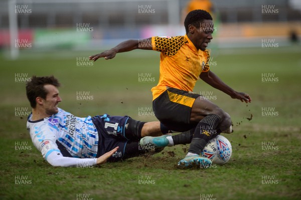 080220 - Newport County v Cambridge United - Sky Bet League 2 -  Jordan Green of Newport County is tackled by Harrison Dunk of Cambridge United 
