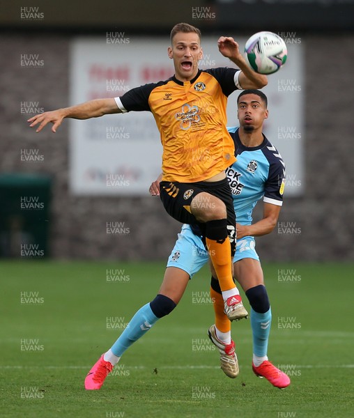 150920 - Newport County v Cambridge United - Carabao Cup - Mickey Demetriou of Newport County is challenged by Harvey Knibbs of Cambridge United