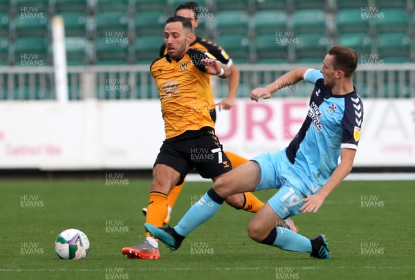 150920 - Newport County v Cambridge United - Carabao Cup - Robbie Willmott of Newport County is challenged by Leon Davies of Cambridge United