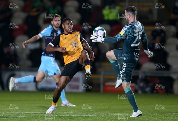 150920 - Newport County v Cambridge United - Carabao Cup - Tristan Abrahams of Newport County is tackled by keeper Callum Burton of Cambridge United