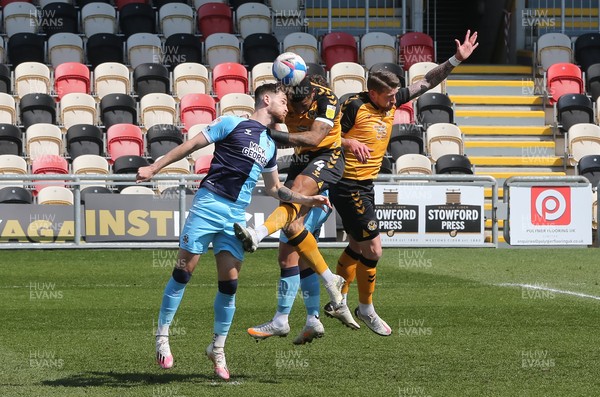170421 Newport County v Cambridge United, Sky Bet League 2 - Joss Labadie of Newport County wins the battle to head the ball