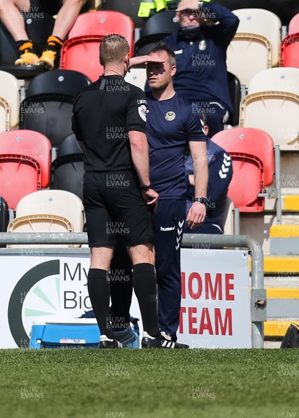 170421 Newport County v Cambridge United, Sky Bet League 2 - Newport County manager Michael Flynn is shown a yellow card by referee Thomas Bramall