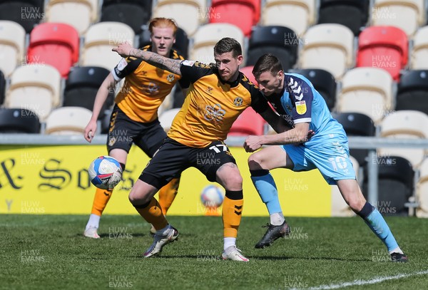170421 Newport County v Cambridge United, Sky Bet League 2 - Scot Bennett of Newport County and Paul Mullin of Cambridge United compete for the ball