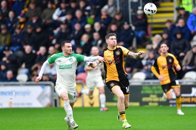 210226 - Newport County v Cambridge United - Sky Bet League 2 - Shane McLoughlin of Cambridge United and James Crole of Newport County 
