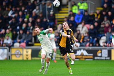 210226 - Newport County v Cambridge United - Sky Bet League 2 - Shane McLoughlin of Cambridge United and James Crole of Newport County 