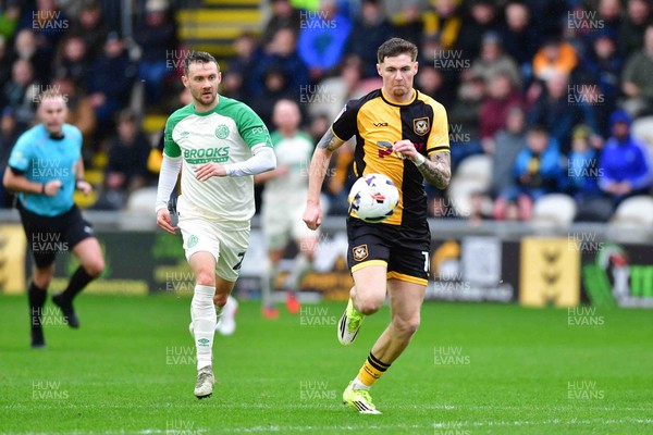 210226 - Newport County v Cambridge United - Sky Bet League 2 - Shane McLoughlin of Cambridge United and James Crole of Newport County 