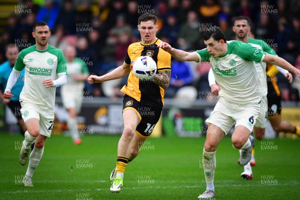 210226 - Newport County v Cambridge United - Sky Bet League 2 - Shane McLoughlin of Cambridge United, James Crole of Newport County and Kelland Watts of Cambridge United 