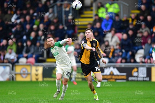 210226 - Newport County v Cambridge United - Sky Bet League 2 - Shane McLoughlin of Cambridge United and James Crole of Newport County 