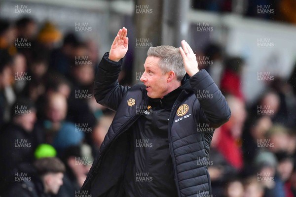 210226 - Newport County v Cambridge United - Sky Bet League 2 - Cambridge head coach Neil Harris does The Ayatollah towards the fans as he goes in for half time