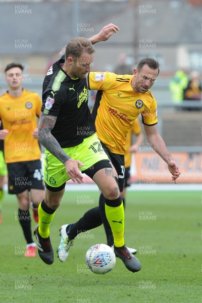 280418 - Newport County v Cambridge United - Sky Bet League 2 - Paul Hayes of Newport County challenges George Taft of Cambridge United
