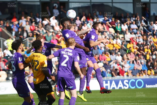 190918 Newport County v Cambridge United - Sky Bet League 2 - Jabo Ibehre of Cambridge United clears a high ball 