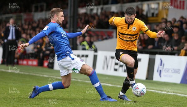 020319 - Newport County v Carlisle United - SkyBet League Two - Padraig Amond of Newport County is tackled by Gary Liddle of Carlisle United