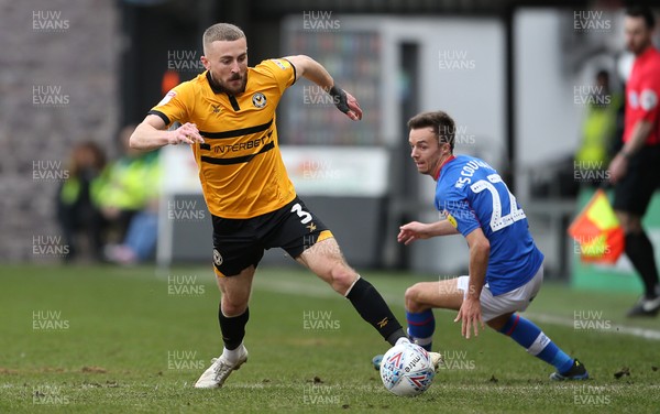 020319 - Newport County v Carlisle United - SkyBet League Two - Dan Butler of Newport County tackles Stefan Scougall of Carlisle United
