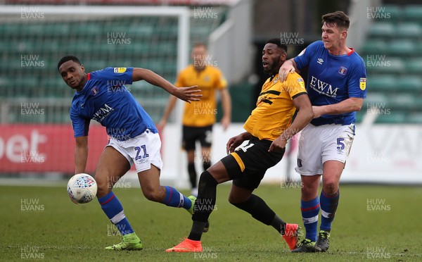 020319 - Newport County v Carlisle United - SkyBet League Two - Jamille Matt of Newport County is held back by Anthony Gerrard of Carlisle United