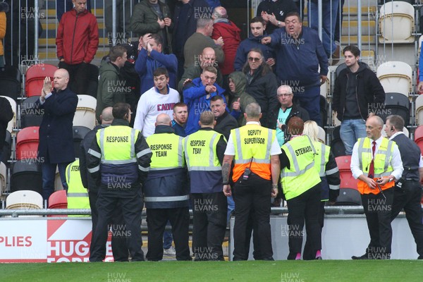 051019 - Newport County v Carlisle United - Sky Bet League 2 - Stewards and fans of Carlisle United clash 