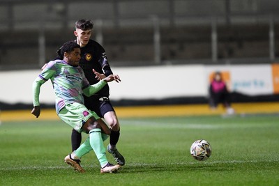 110225 - Newport County v Carlisle United - Sky Bet League 2 - Joe Thomas of Newport County is challenged by Kadeem Harris of Carlisle United 