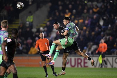 110225 - Newport County v Carlisle United - Sky Bet League 2 - Courtney Baker-Richardson of Newport County is challenged by Sam Lavelle of Carlisle United 