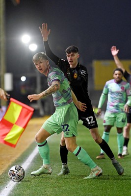 110225 - Newport County v Carlisle United - Sky Bet League 2 - Joe Thomas of Newport County is challenged by Charlie McArthur of Carlisle United 