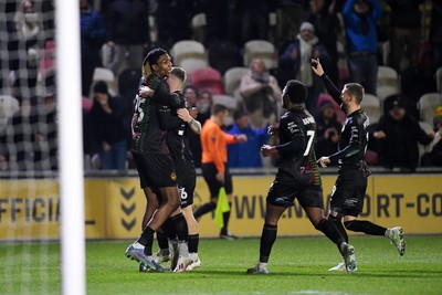 110225 - Newport County v Carlisle United - Sky Bet League 2 - Kyle Hudlin of Newport County celebrates scoring the opening goal with team mates 