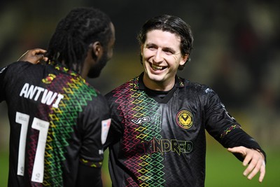 110225 - Newport County v Carlisle United - Sky Bet League 2 - Anthony Glennon of Newport County celebrates the win at full time with Cameron Antwi  