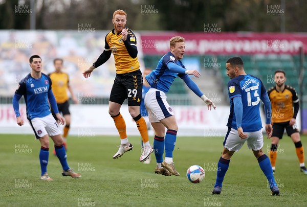 130421 - Newport County v Carlisle United - SkyBet League Two - Ryan Taylor of Newport County and Callum Guy of Carlisle United go up for the ball