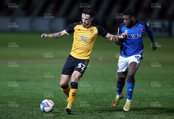 130421 - Newport County v Carlisle United - SkyBet League Two - Liam Shephard of Newport County is challenged by Offrande Zanzala of Carlisle United