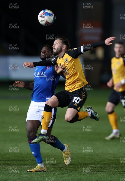 130421 - Newport County v Carlisle United - SkyBet League Two - Josh Sheehan of Newport County is challenged by Offrande Zanzala of Carlisle United