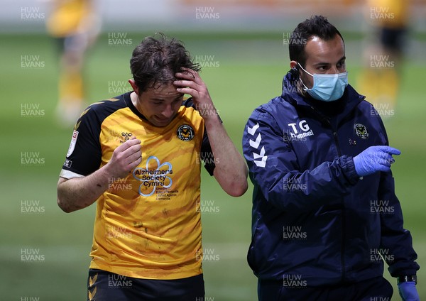 130421 - Newport County v Carlisle United - SkyBet League Two - Matthew Dolan of Newport County goes off the field injured