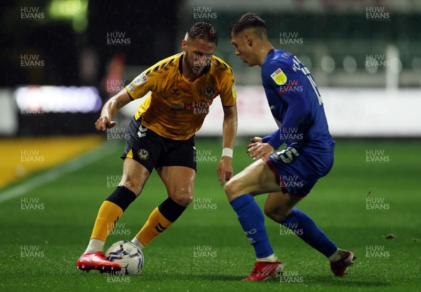 191021 - Newport County v Carlisle United - SkyBet League Two - Cameron Norman of Newport County is challenged by Taylor Charters of Carlisle