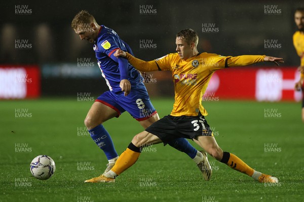 191021 - Newport County v Carlisle United - SkyBet League Two - Callum Guy of Carlisle is tackled by Ollie Cooper of Newport County
