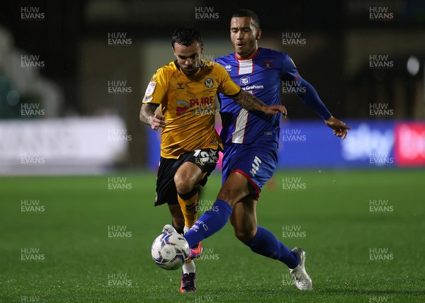 191021 - Newport County v Carlisle United - SkyBet League Two - Dom Telford of Newport County is tackled by Rod McDonald of Carlisle