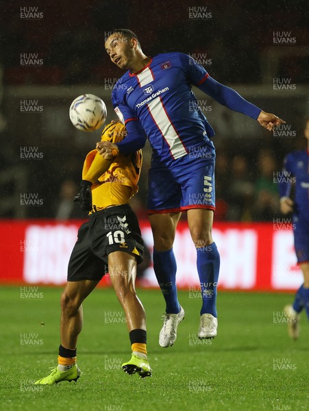191021 - Newport County v Carlisle United - SkyBet League Two - Courtney Baker-Richardson of Newport County is challenged by Rod McDonald of Carlisle