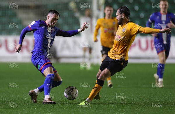 191021 - Newport County v Carlisle United - SkyBet League Two - Joe Riley of Carlisle is challenged by Edward Upson of Newport County