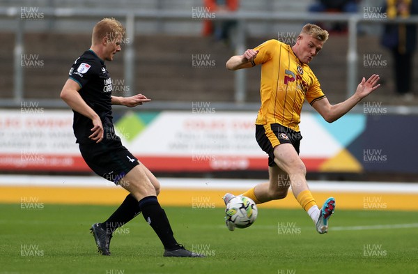 080823 - Newport County v Charlton Athletic - Carabao Cup - Will Evans of Newport County is challenged by Miles Leaburn of Charlton Athletic 
