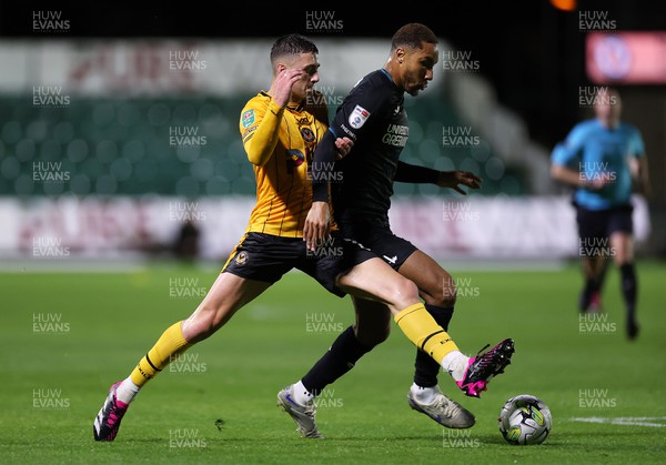 080823 - Newport County v Charlton Athletic - Carabao Cup - Josh Seberry of Newport County is challenged by Terell Thomas of Charlton Athletic 