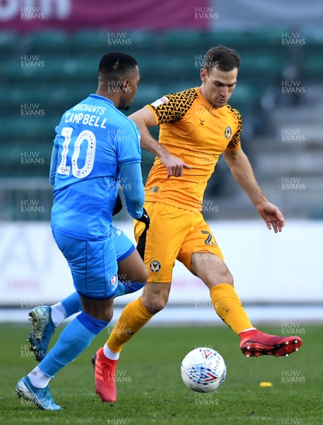 010120 - Newport County v Cheltenham Town - SkyBet League 2 - Mickey Demetriou of Newport County is tackled by Tahvon Campbell of Cheltenham Town