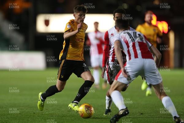 071117 - Newport County v Cheltenham Town - Checkatrade Trophy - Tom Hillman of Newport County is challenged by Daniel O'Shaughnessy of Cheltenham Town