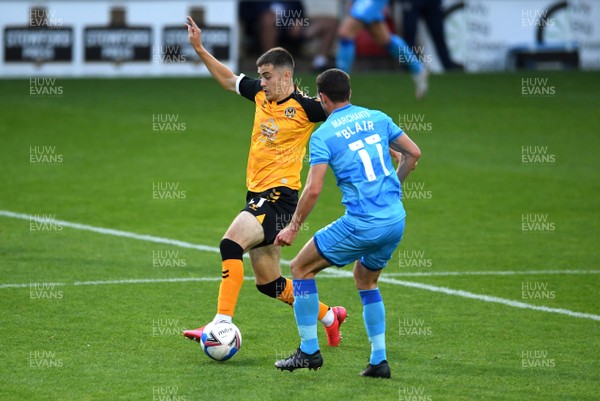 080920 - Newport County v Cheltenham Town - EFL Trophy - Lewis Collins of Newport County is tackled by Matty Blair of Cheltenham Town