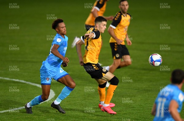 080920 - Newport County v Cheltenham Town - EFL Trophy - Lewis Collins of Newport County is tackled by Elliot Bonds of Cheltenham Town