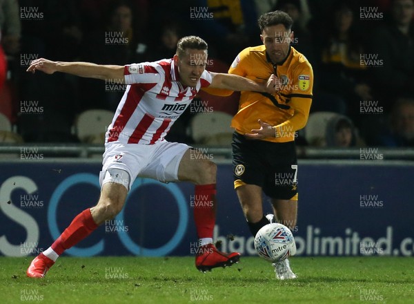150319 - Newport County v Cheltenham Town, SkyBet League 2 - Robbie Willmott of Newport County and Chris Hussey of Cheltenham Town compete for the ball