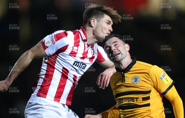 150319 - Newport County v Cheltenham Town, SkyBet League 2 - Padraig Amond of Newport County and Charlie Raglan of Cheltenham Town compete for the ball