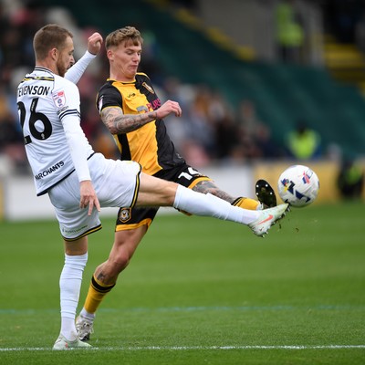 181025 - Newport County v Cheltenham Town - Sky Bet League 2 - Kai Whitmore of Newport County is challenged by Ben Stevenson of Cheltenham Town