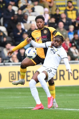 181025 - Newport County v Cheltenham Town - Sky Bet League 2 - Bobby Kamwa of Newport County is challenged by Ethon Archer of Cheltenham Town
