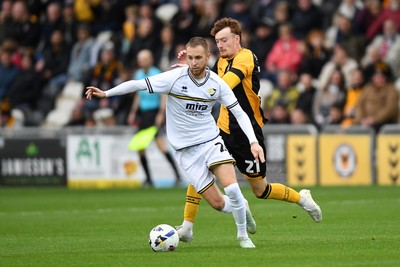 181025 - Newport County v Cheltenham Town - Sky Bet League 2 - Michael Spellman of Newport County is challenged by Ben Stevenson of Cheltenham Town